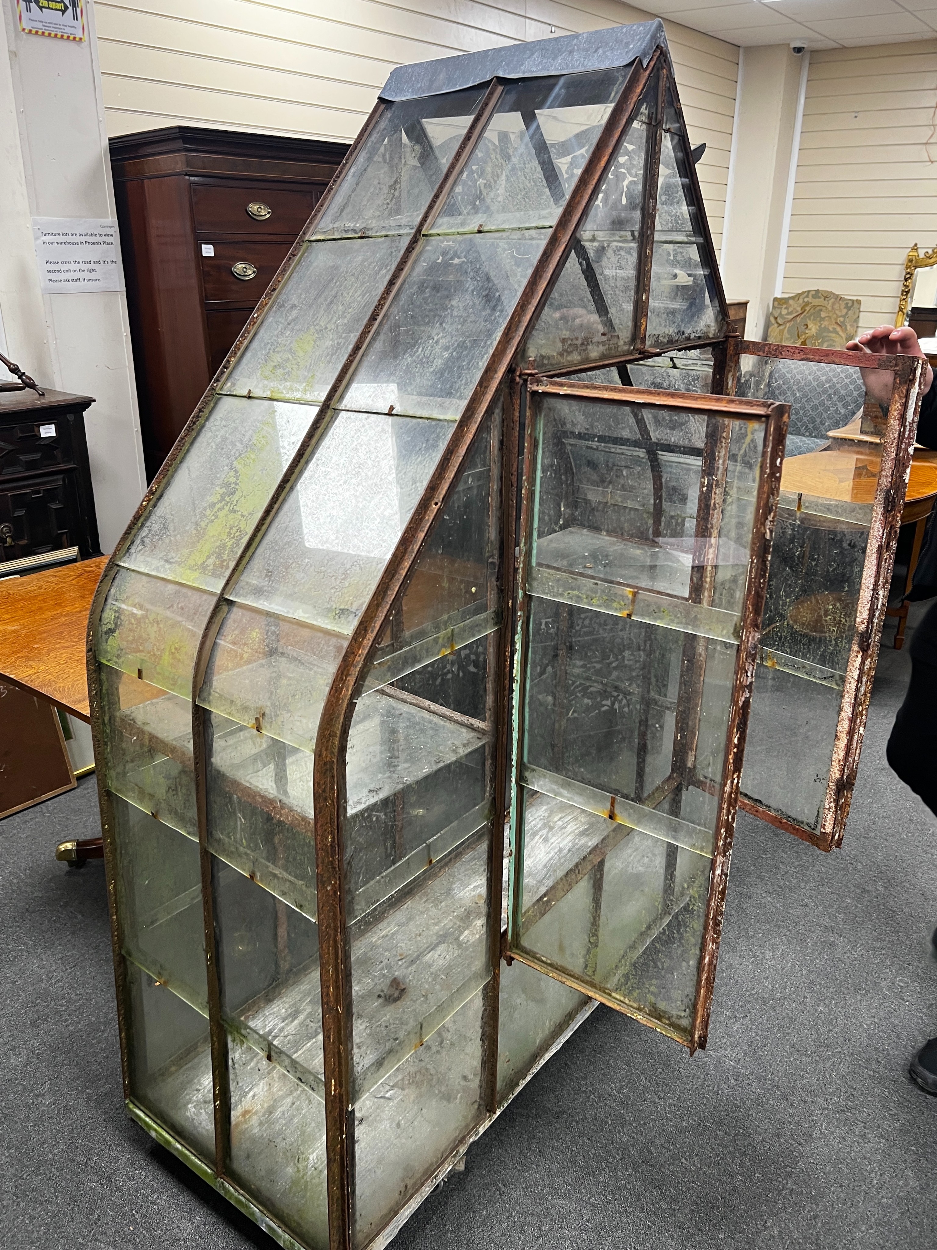 A vintage arched greenhouse on wheeled base, width 136cm, depth 51cm, height 174cm